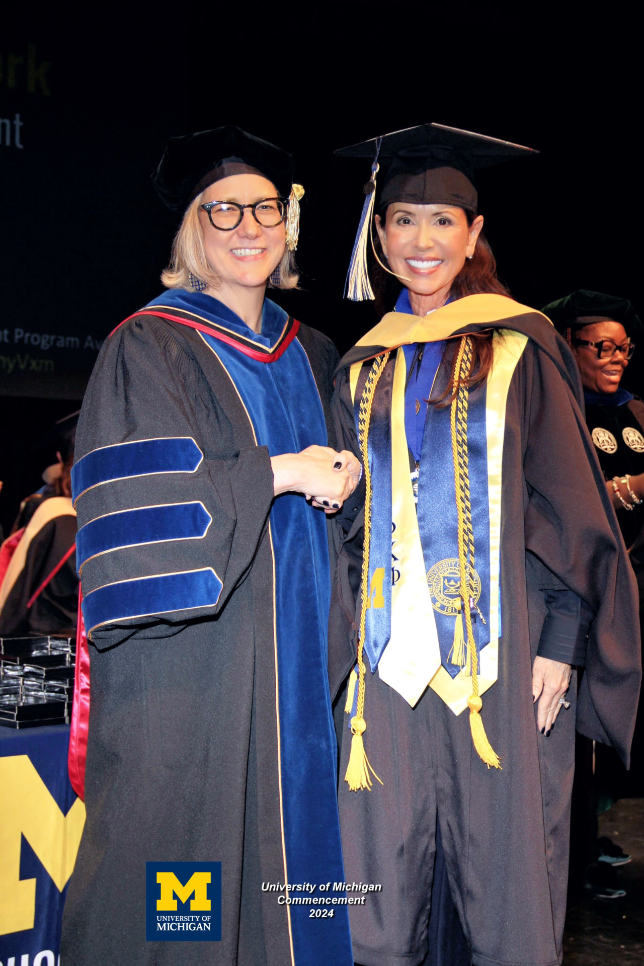 Lisa Neilson with the Dean at the 2024 University of Michigan commencement